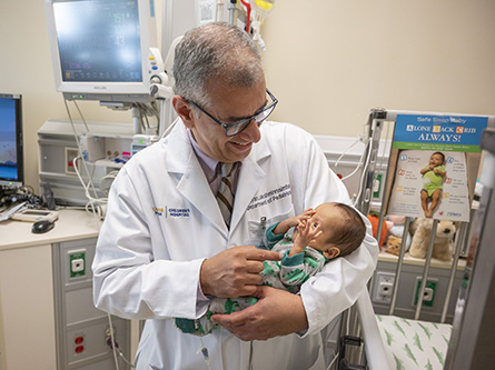 doctor and infant in NICU